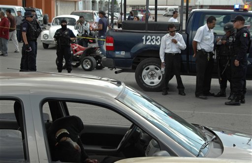  bottom, who works for Diario de Juarez newspaper, lies in his car